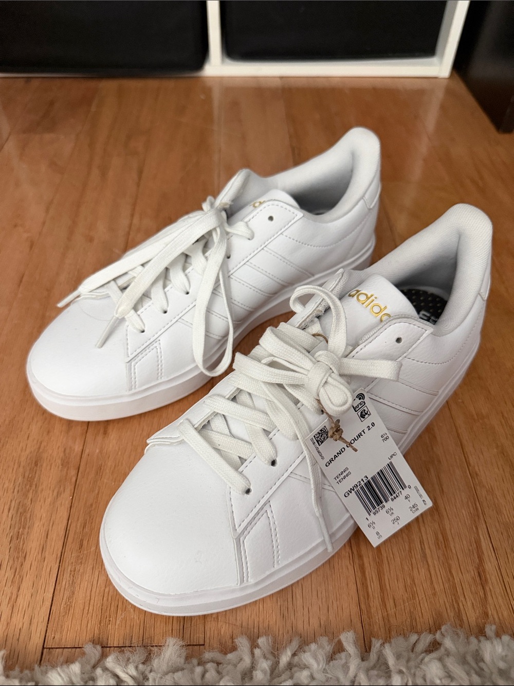 adidas Women’s White Low-Top Sneakers with Gold Logo